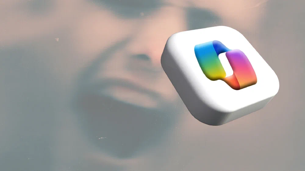 Microsoft Copilot logo on a white rounded tile floating over a blurred, ominous face in the background, symbolising surveillance and loss of privacy